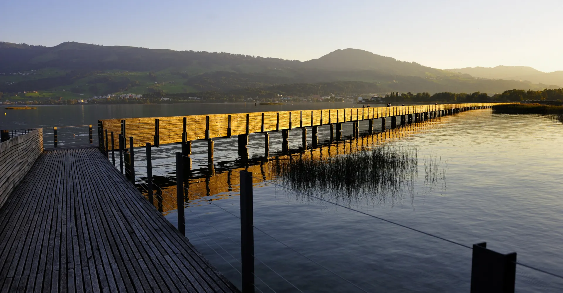 Wooden jetty on Lake Zurich in Rapperswil in the evening