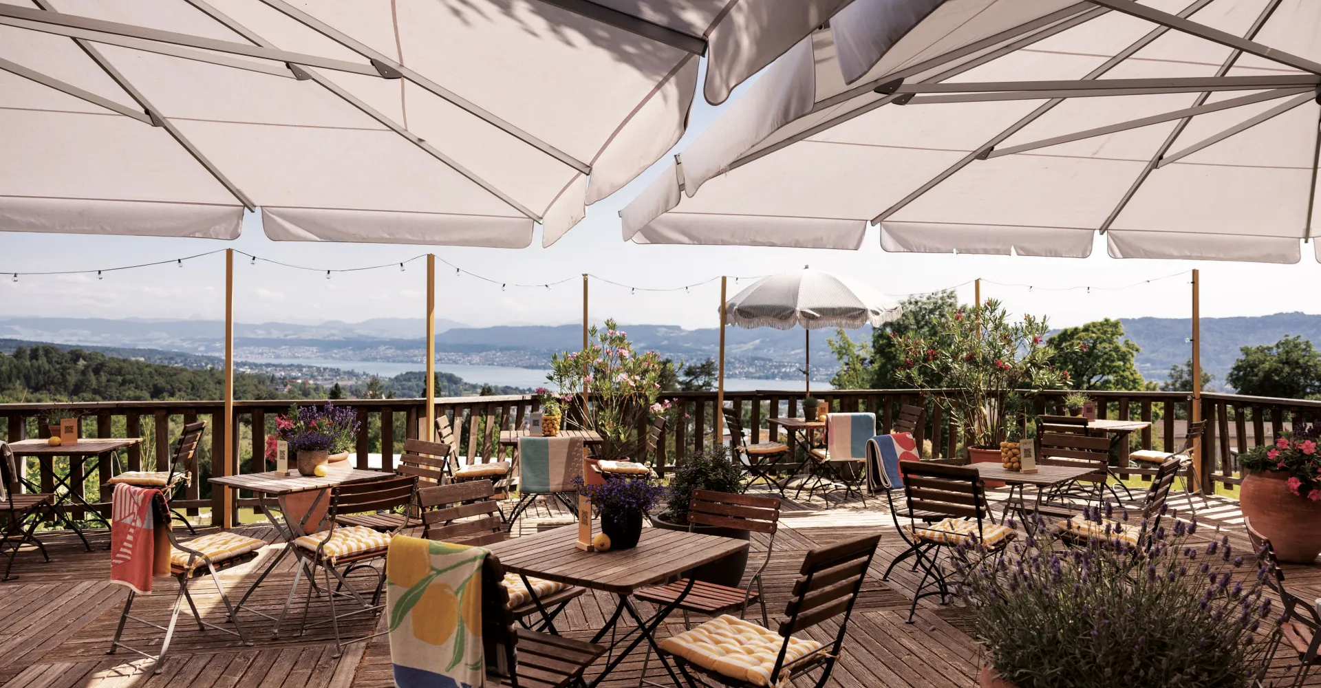 The terrace with chairs and tables at the Hotel Zürichberg