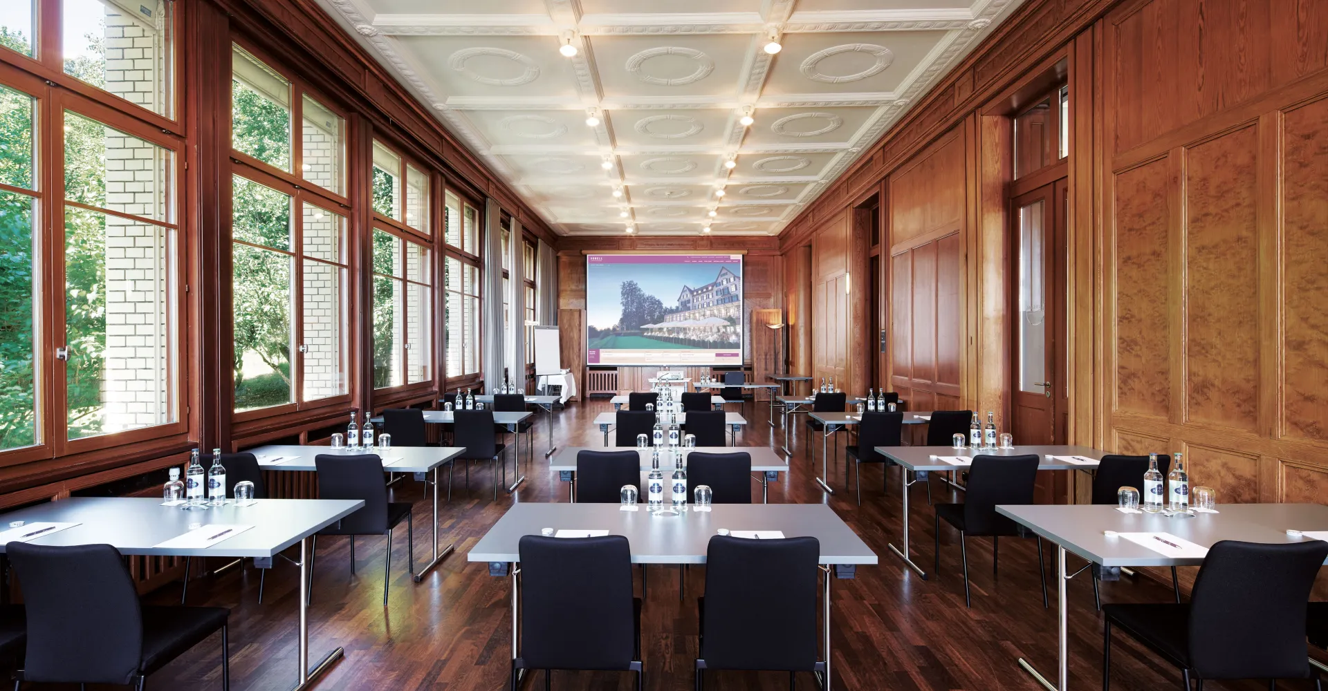 Kursaal 1 with tables and chairs at the Hotel Zürichberg