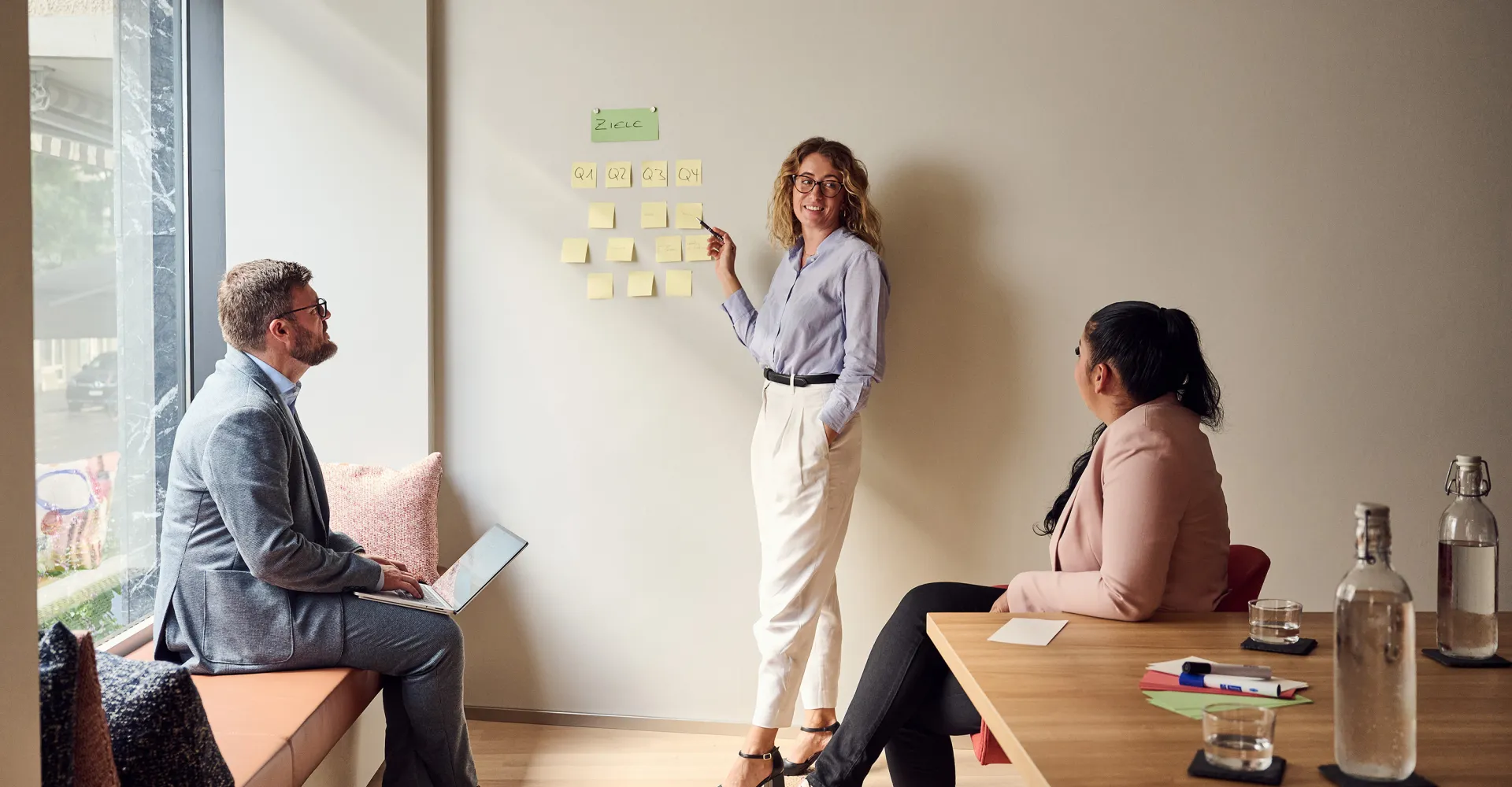 three people in a meeting