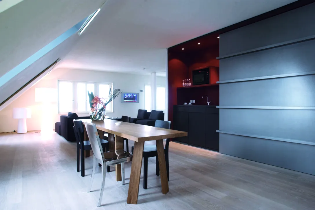 Sorell Hotel Rigiblick Grand Studio with kitchenette and dining table