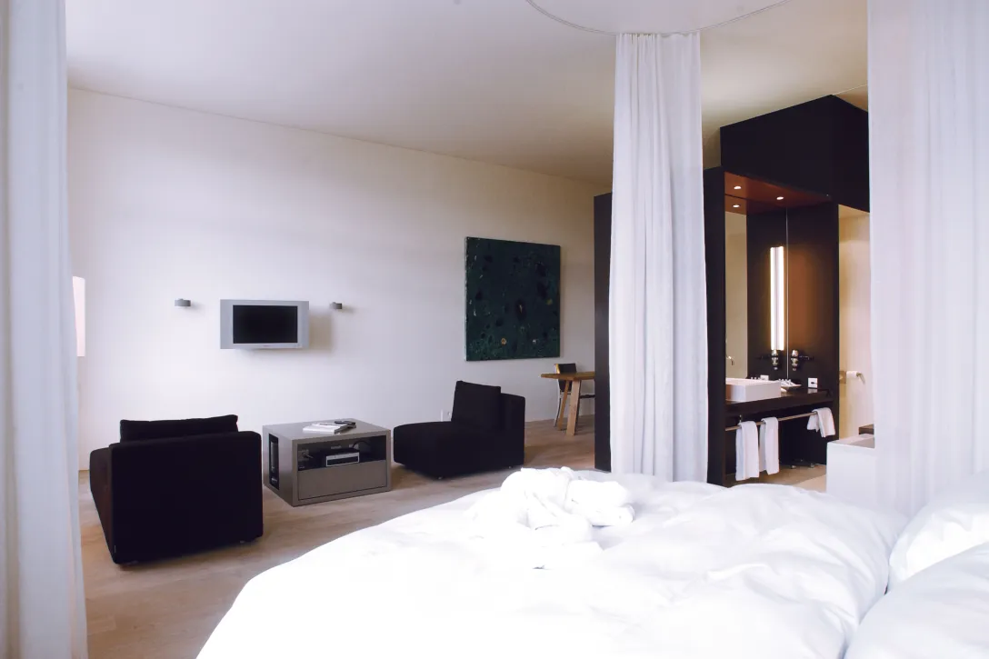 Sorell Hotel Rigiblick Studio bedroom with sitting area