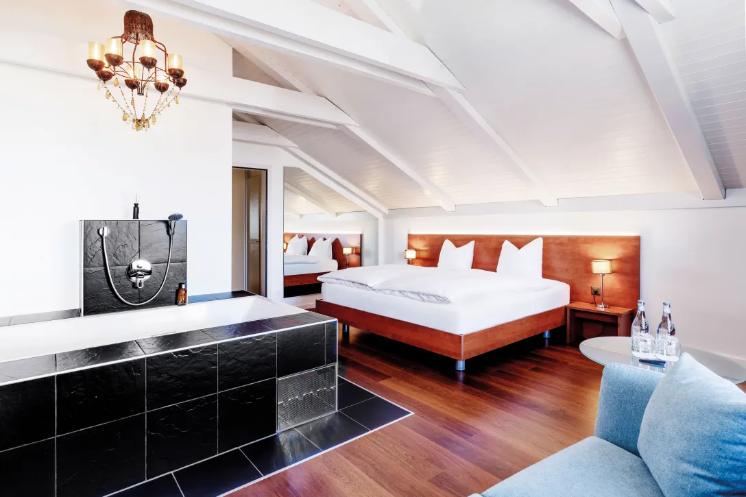 Sorell Hotel Sonnental Double room with whirlpool and seating area