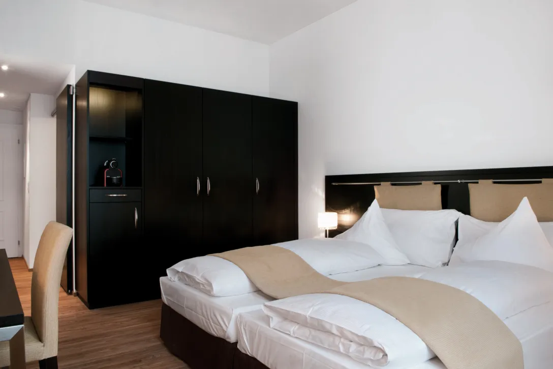 Superior twin room with wardrobe at the Sorell Hotel Tamina in Bad Ragaz