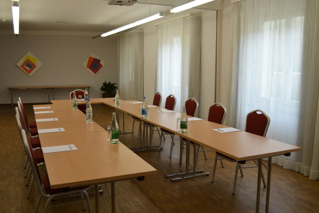 HHotel Tamina meeting room with tables and chairs including pad and pen