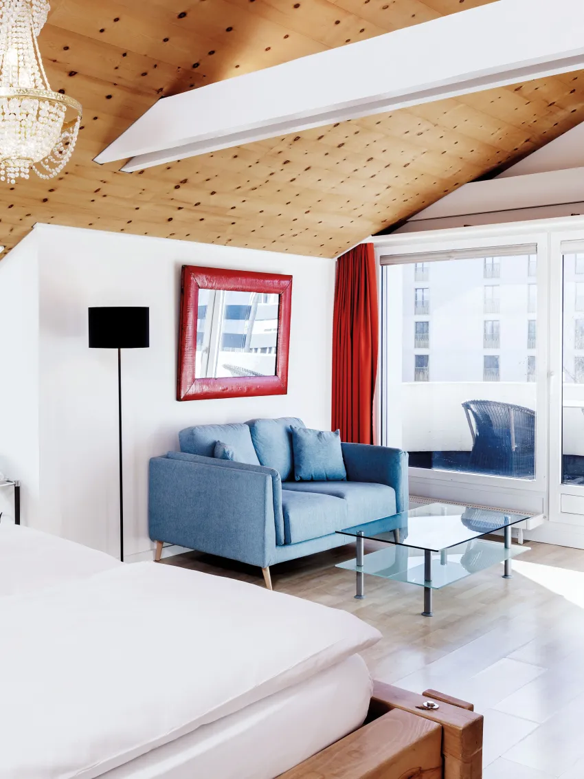 Sorell Hotel Sonnental Double room with whirlpool and seating area with balcony