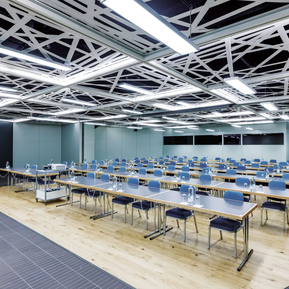 Seminar room with tables and chairs in a row