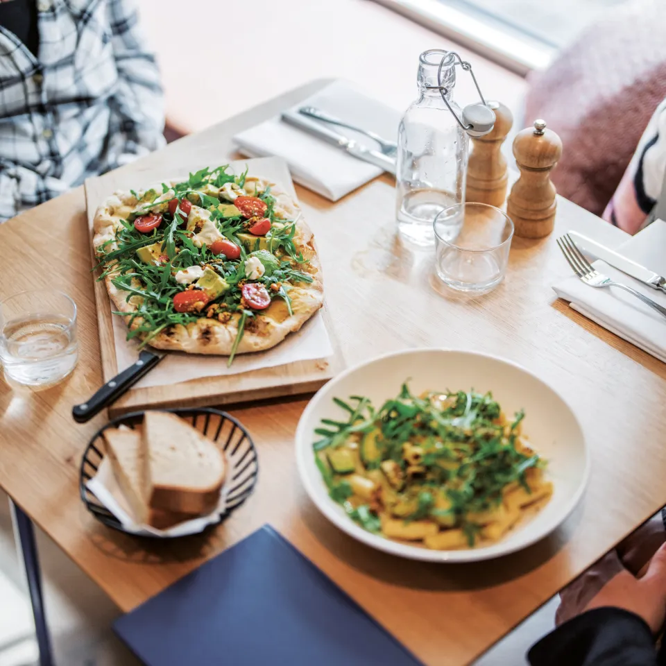 two people eat in the Flor Cafe Bar