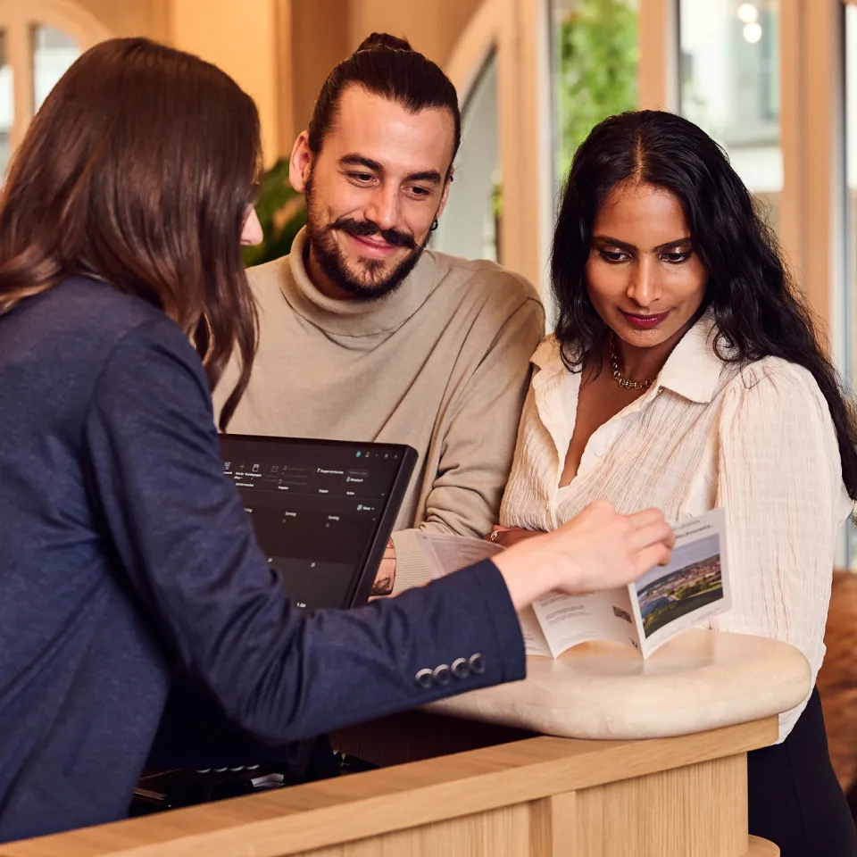 Couple checks into a hotel