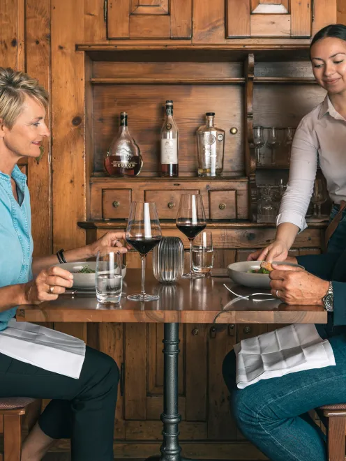 Restaurant in St. Gallen with a couple and a waitress
